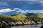 Clay cliffs along the Flathead River with Mission Mountains near Ronan, Montana, USA. Art Print